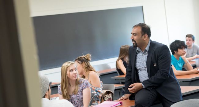 josey chacko talking to student in class