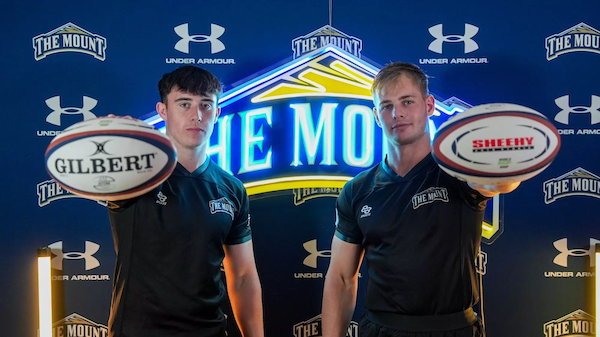 msmu men's rugby players holding a ball