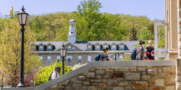 msmu student walking up stairs into library