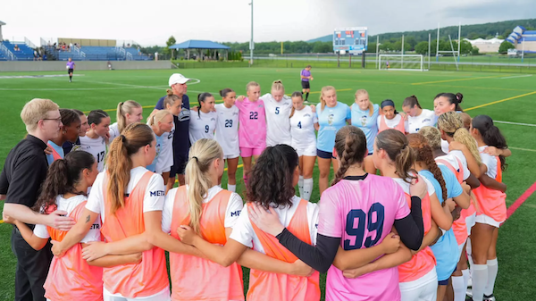 msmu women's soccer team in a huddle