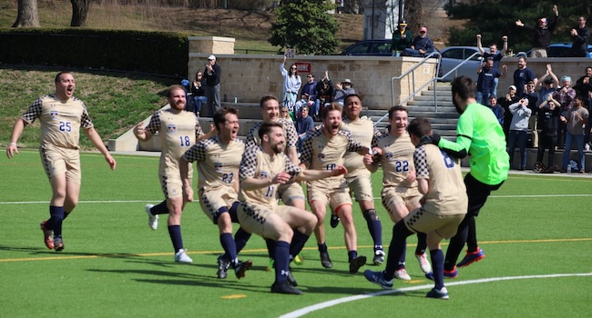 seminarians celebrating after winning the vianney cup in soccer