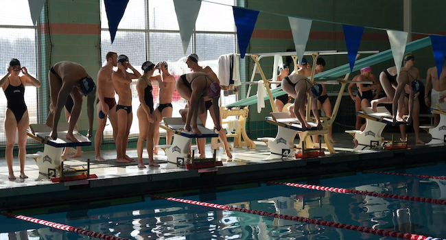 women's swimming and diving at a meet in fall 2025